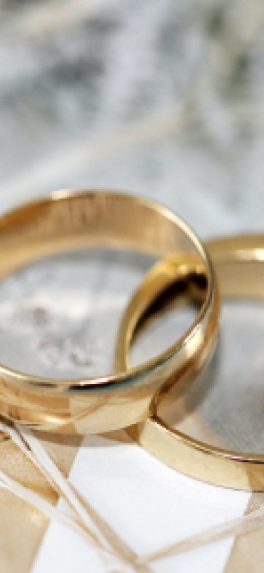 Two wedding bands on a table.
