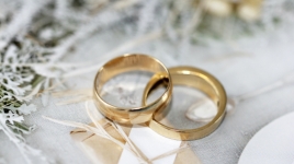 Two wedding bands on a table.